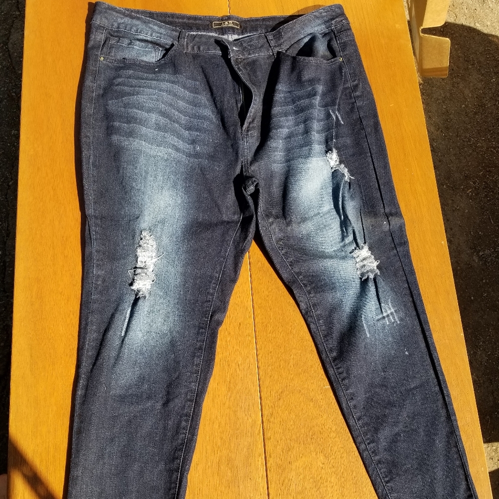 Distressed blue jeans